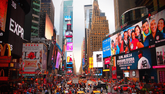 busy city intersection with billboards and lights