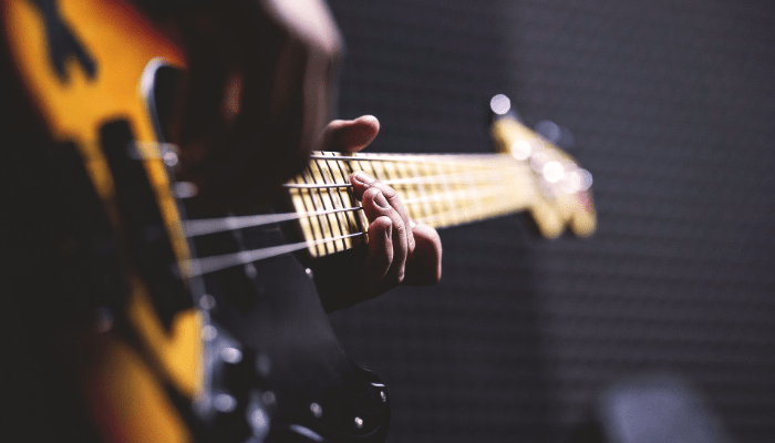 close up of strings of bass guitar