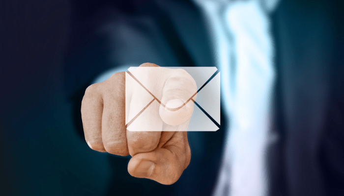finger pointing to email icon
