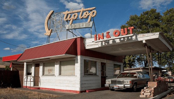 vintage drive through restaurant called "tip top in & out"